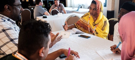 people sitting at the table discussing