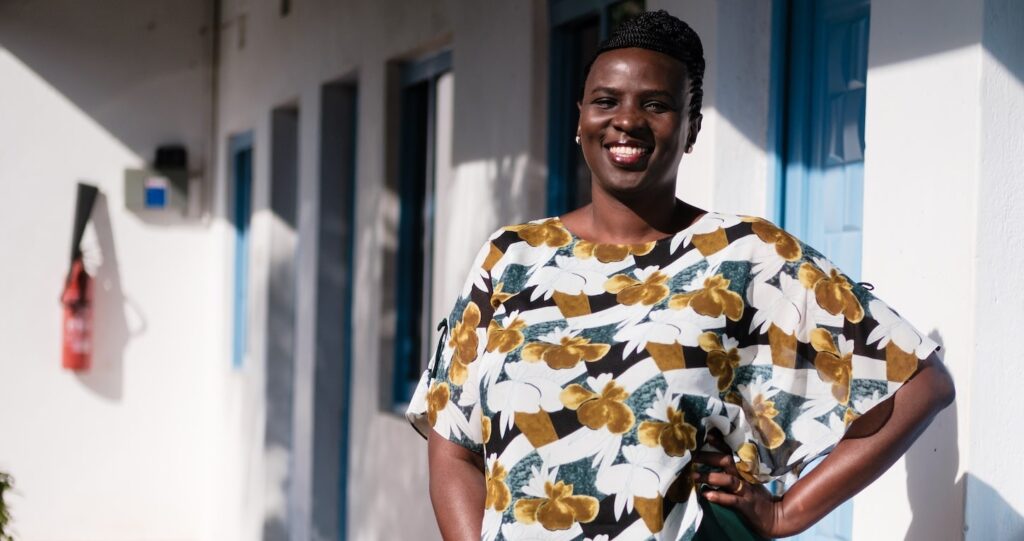 a woman posing for a photo smiling at camera